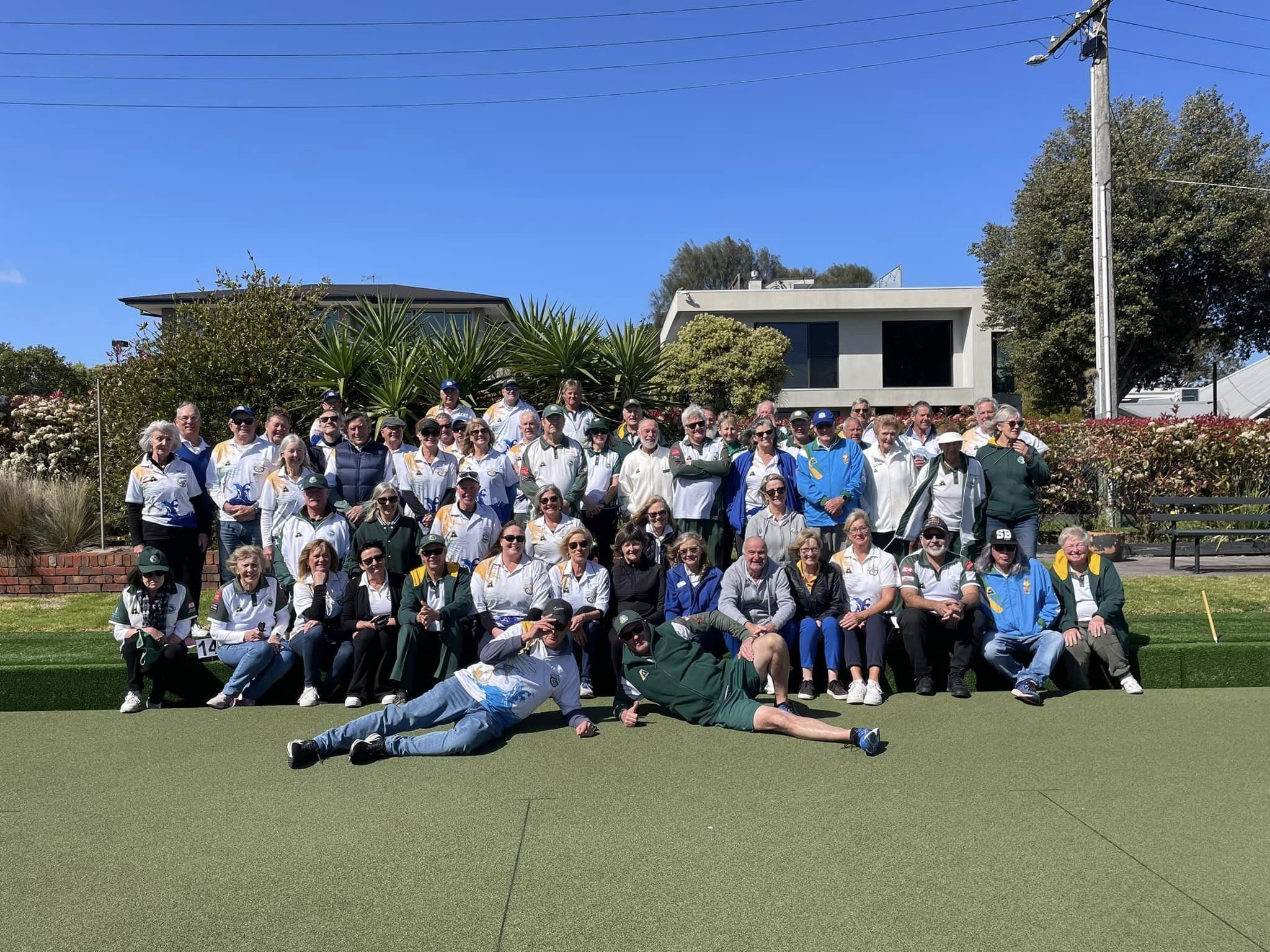 A full club day group photo on the green in front of the houses of Hampton